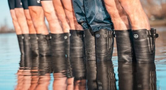 Oxford men wearing Le Chameau boots